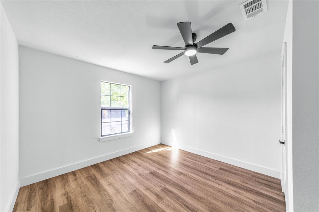 403 Melody Circle Kaufman, TX 75142 - Photo 11 of 25 a view of a big room with wooden floor and windows