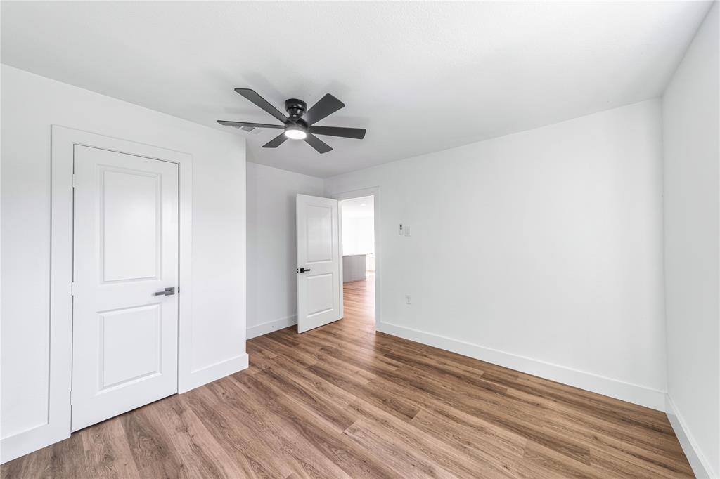 403 Melody Circle Kaufman, TX 75142 - Photo 12 of 25 a view of empty room with wooden floor