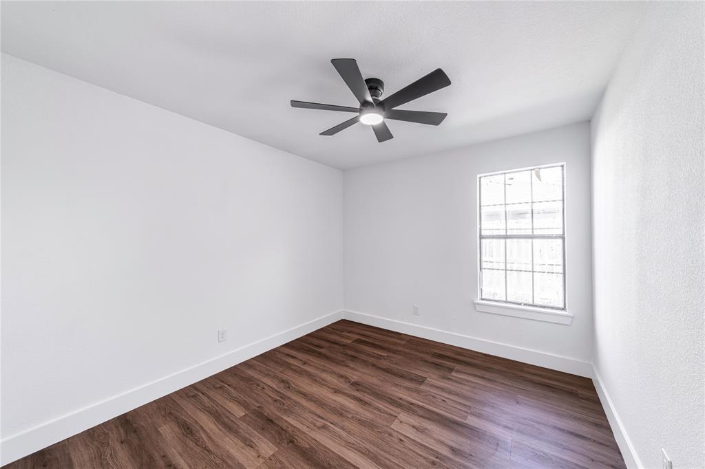 403 Melody Circle Kaufman, TX 75142 - Photo 14 of 25 wooden floor in an empty room with a window