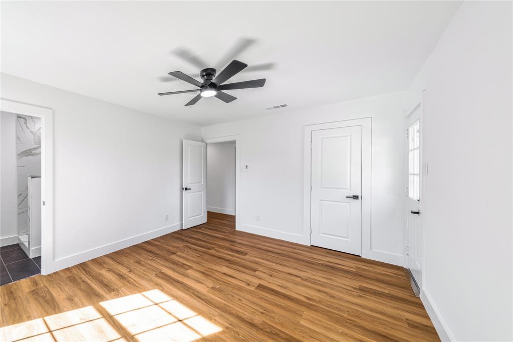 403 Melody Circle Kaufman, TX 75142 - Photo 20 of 25 a view of a livingroom with a chandelier fan and wooden floor