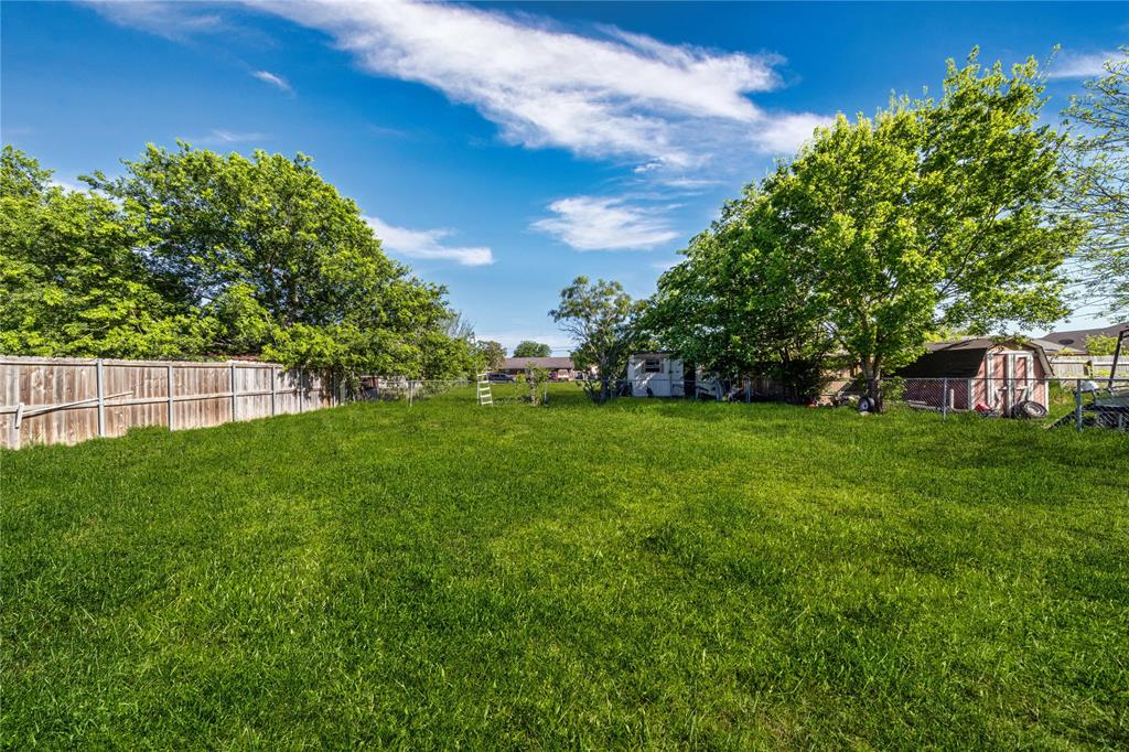 403 Melody Circle Kaufman, TX 75142 - Photo 22 of 25 a view of yard with grass and trees
