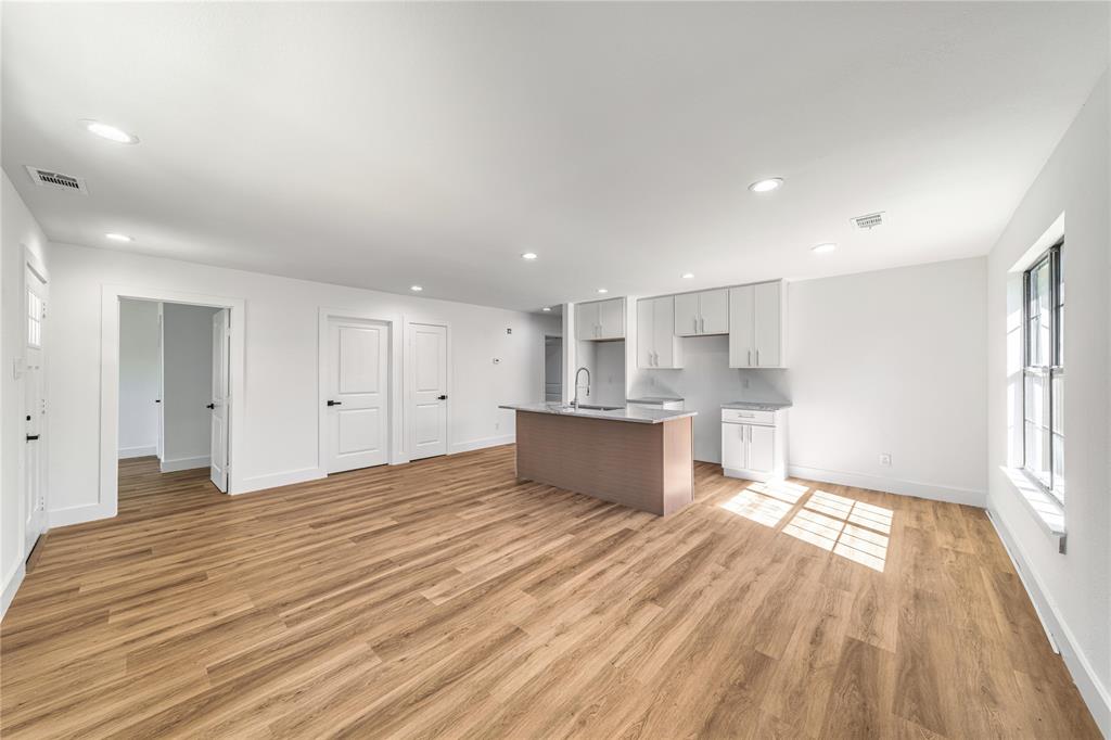 403 Melody Circle Kaufman, TX 75142 - Photo 5 of 25 a view of kitchen with wooden floor and window