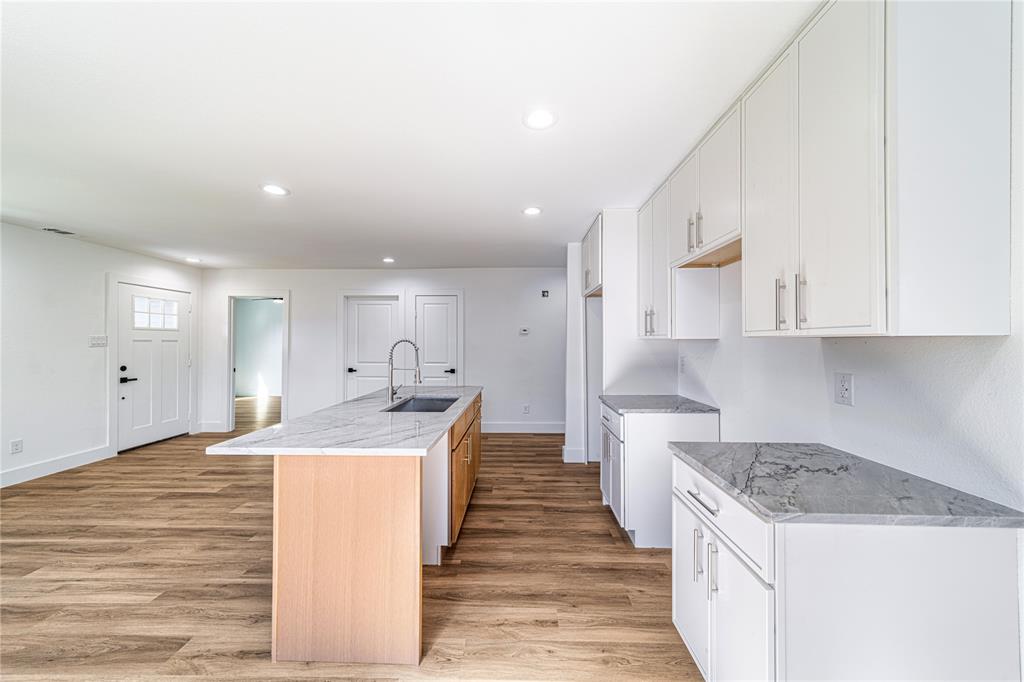 403 Melody Circle Kaufman, TX 75142 - Photo 6 of 25 a kitchen with a sink stove and cabinets