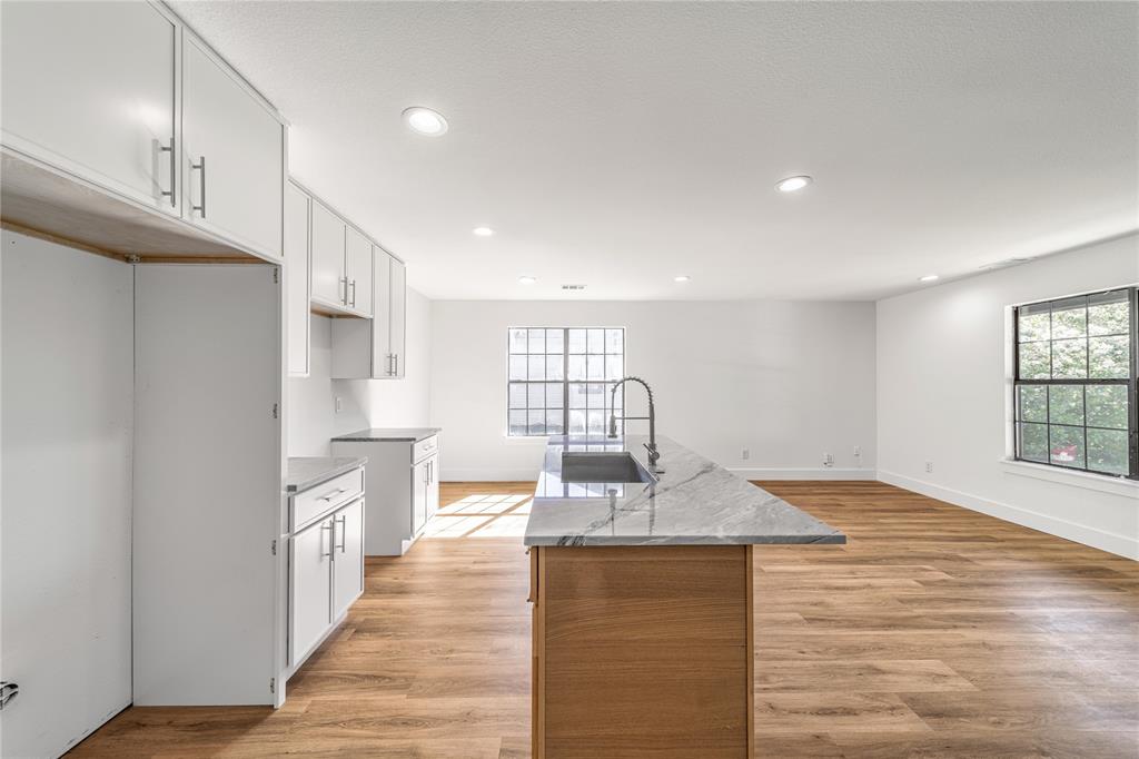 403 Melody Circle Kaufman, TX 75142 - Photo 10 of 25 a kitchen with stainless steel appliances granite countertop a sink stove and refrigerator