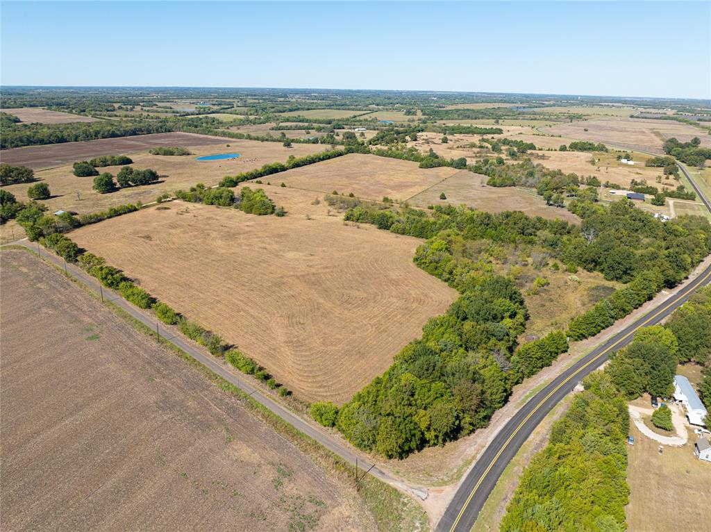 12 Fm 2675 Roxton, TX 75477 - Photo 1 of 8 an aerial view of ocean and residential houses with outdoor space