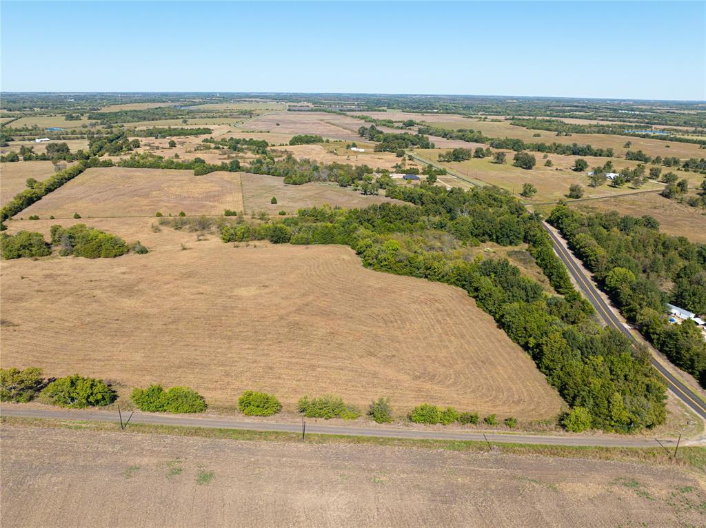 12 Fm 2675 Roxton, TX 75477 - Photo 2 of 8 an aerial view of ocean and residential houses with outdoor space