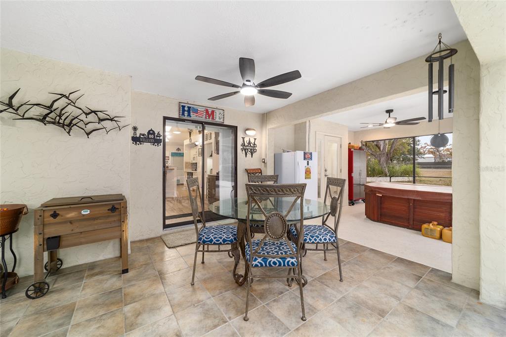 3 Fir Trail Ocala, FL 34472 - Photo 11 of 74 a view of a dining room with furniture and a chandelier