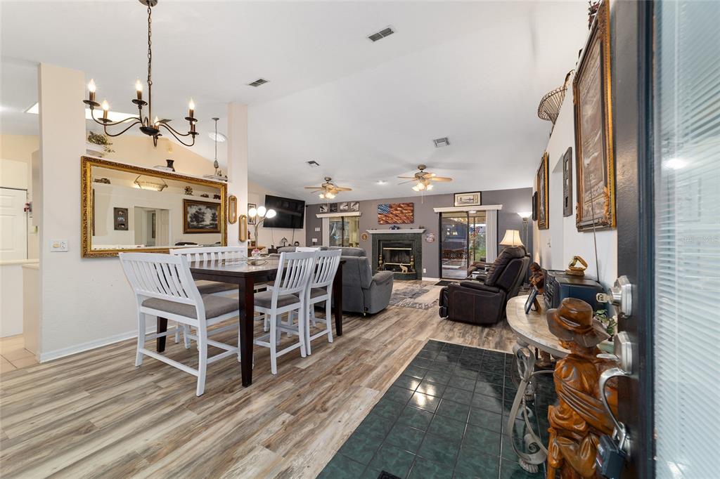3 Fir Trail Ocala, FL 34472 - Photo 24 of 74 a living room with lots of furniture and a chandelier