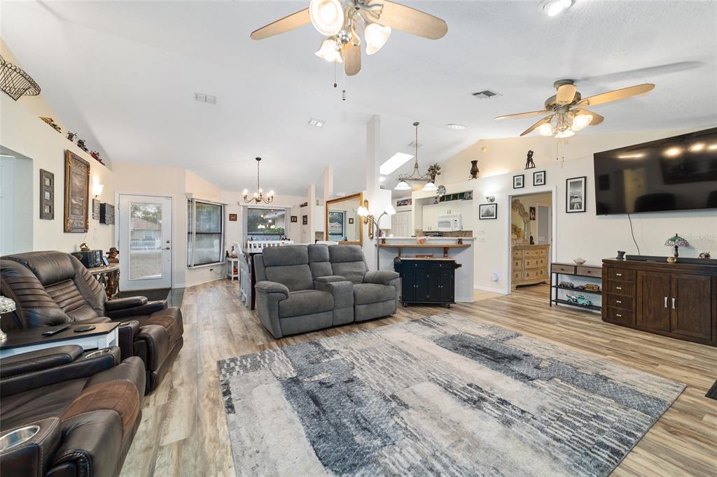 3 Fir Trail Ocala, FL 34472 - Photo 28 of 74 a living room with furniture and a flat screen tv