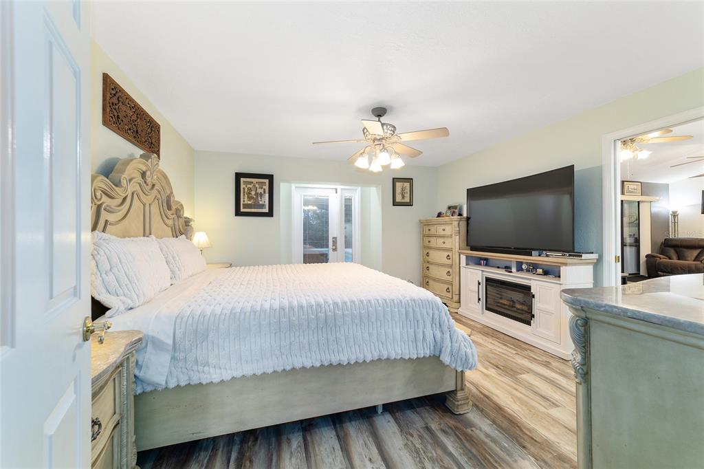 3 Fir Trail Ocala, FL 34472 - Photo 43 of 74 a bedroom with a bed and a flat screen tv