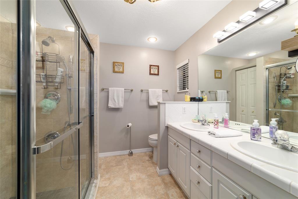 3 Fir Trail Ocala, FL 34472 - Photo 45 of 74 a bathroom with a double vanity sink mirror and double