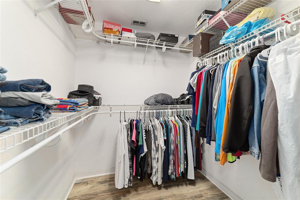 3 Fir Trail Ocala, FL 34472 - Photo 47 of 74 a view of walk in closet with clothes and shoes