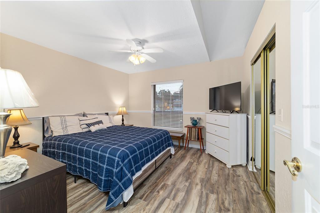 3 Fir Trail Ocala, FL 34472 - Photo 57 of 74 a bedroom with a bed and a flat screen tv