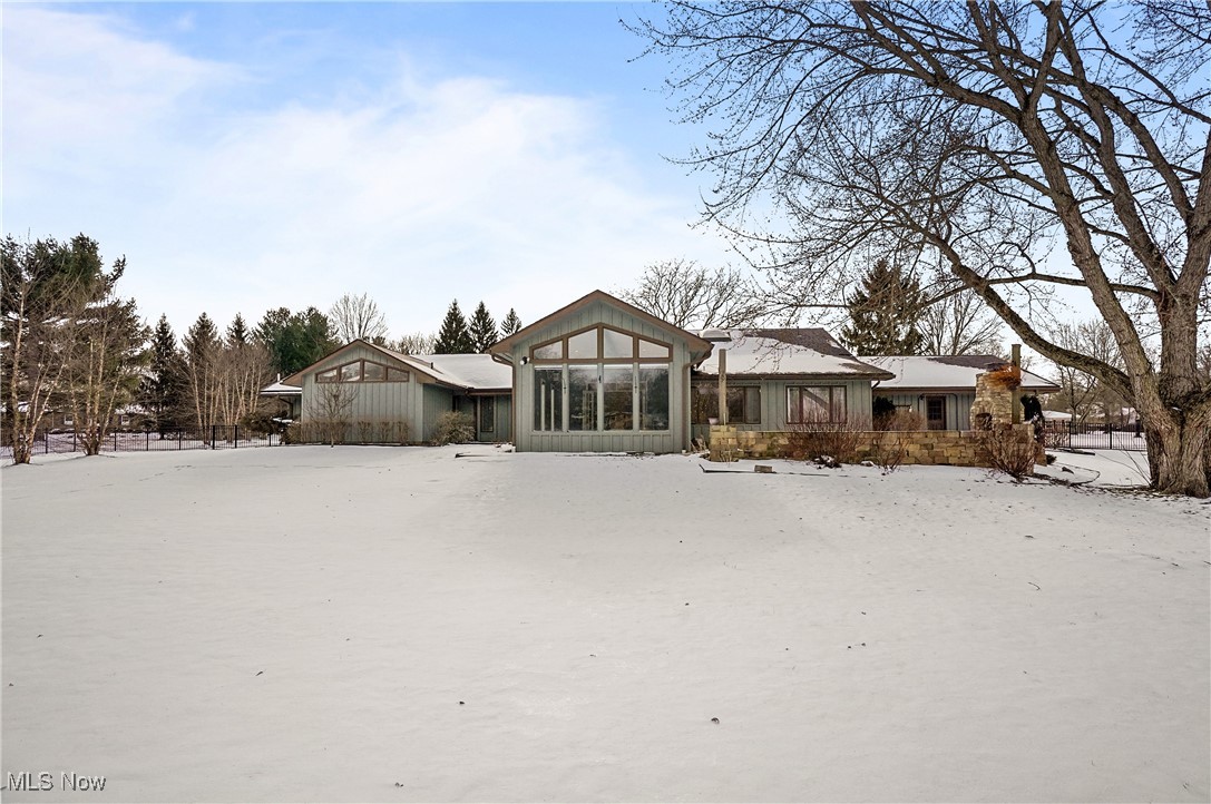 1094 San Raphael Drive Akron, OH 44333 - Photo 42 of 50 Snow covered property with a sunroom