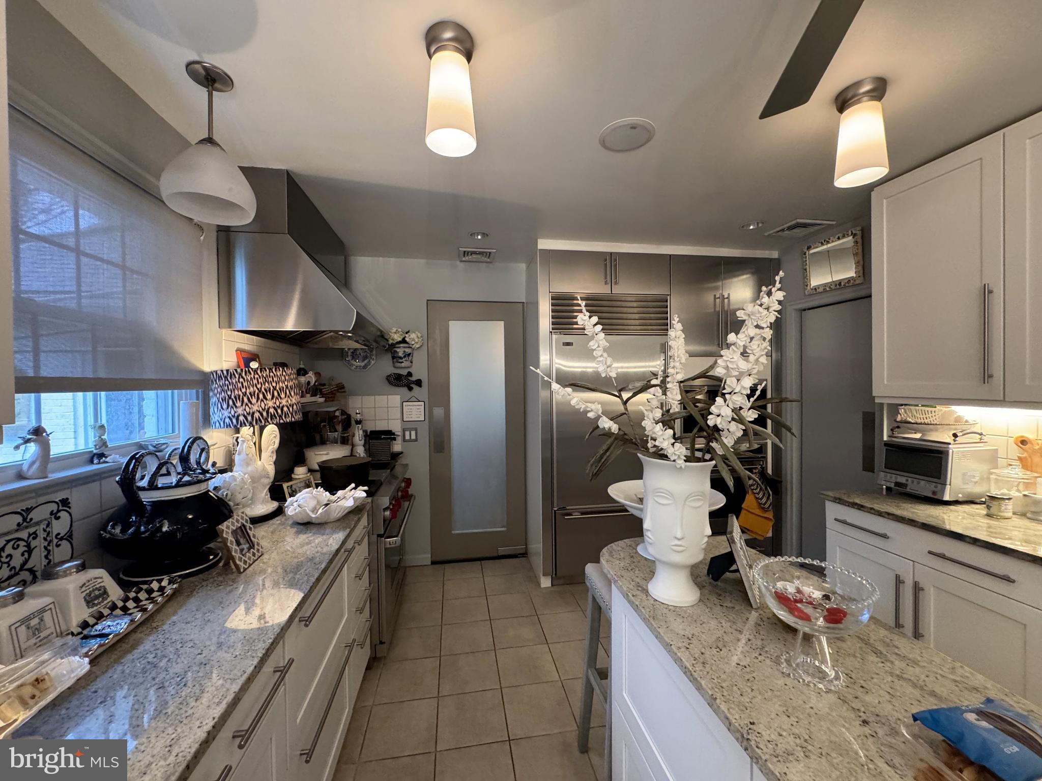 357 Sprague Road Penn Valley, PA 19072 - Photo 20 of 44 a kitchen with granite countertop lots of counter top space and stainless steel appliances