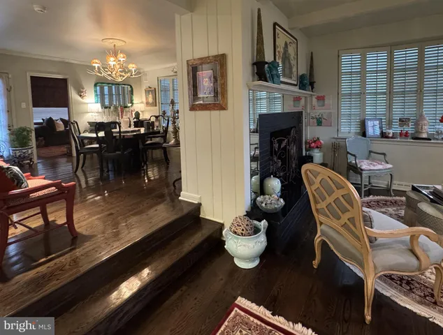a living room with furniture fireplace and flat screen tv