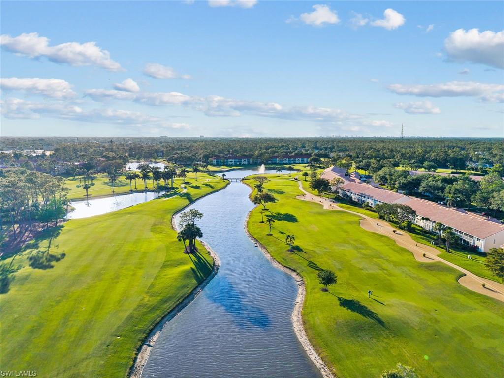 5928 Cranbrook Way, Unit D202 Naples, FL 34112 - Photo 17 of 23 Bird's eye view with a water view and golf course view