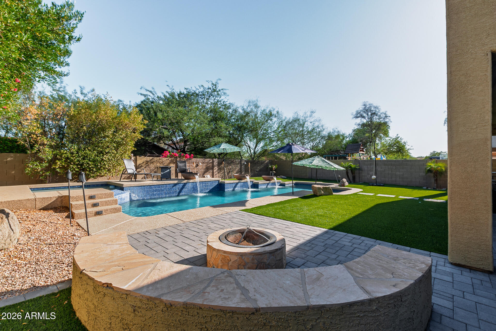 4521 West Moss Springs Road Anthem, AZ 85086 - Photo 2 of 35 a view of a swimming pool with a patio