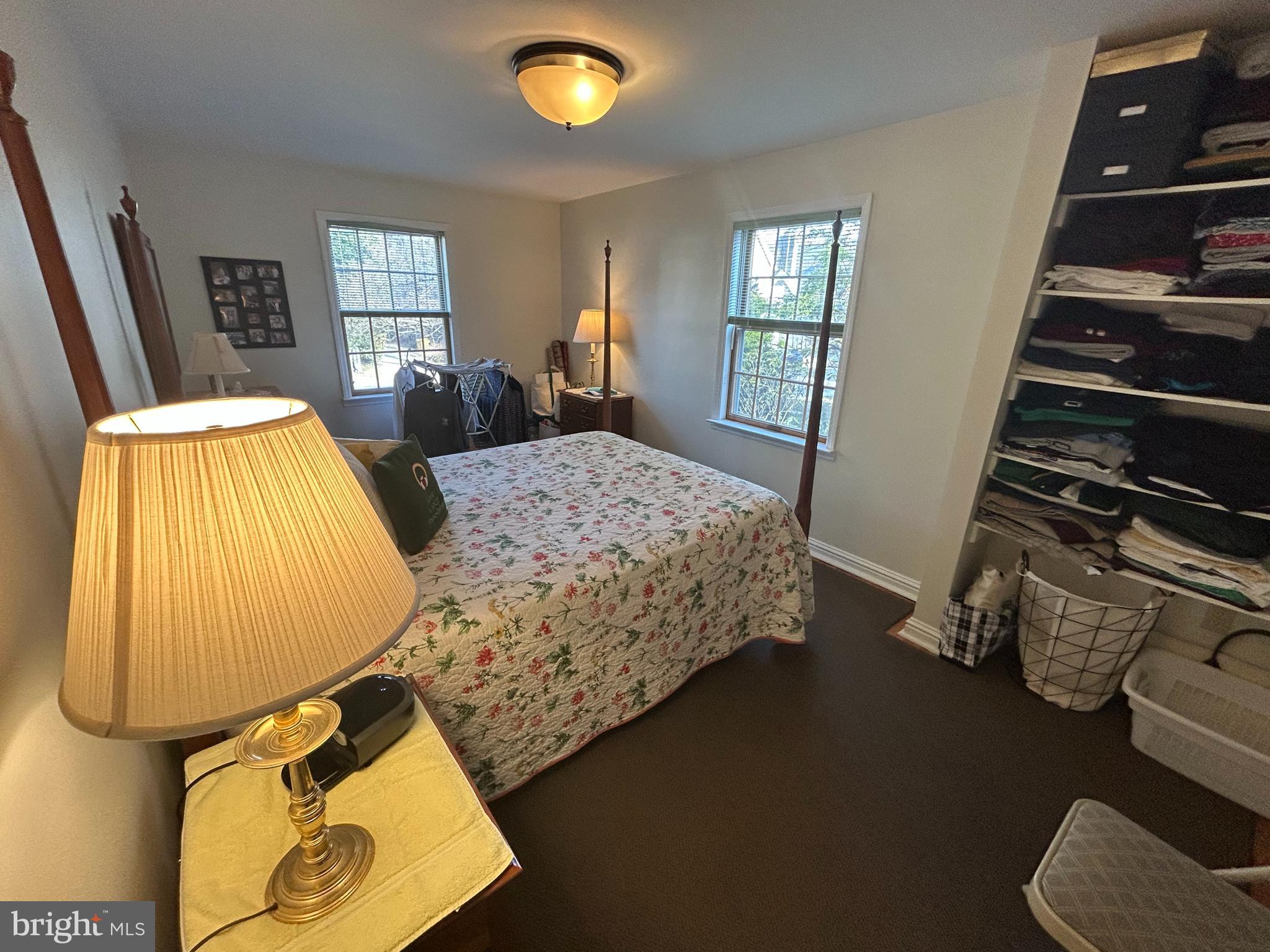214 Grayling Avenue, Unit ONE Narberth, PA 19072 - Photo 12 of 22 a bedroom with bed and wooden floor