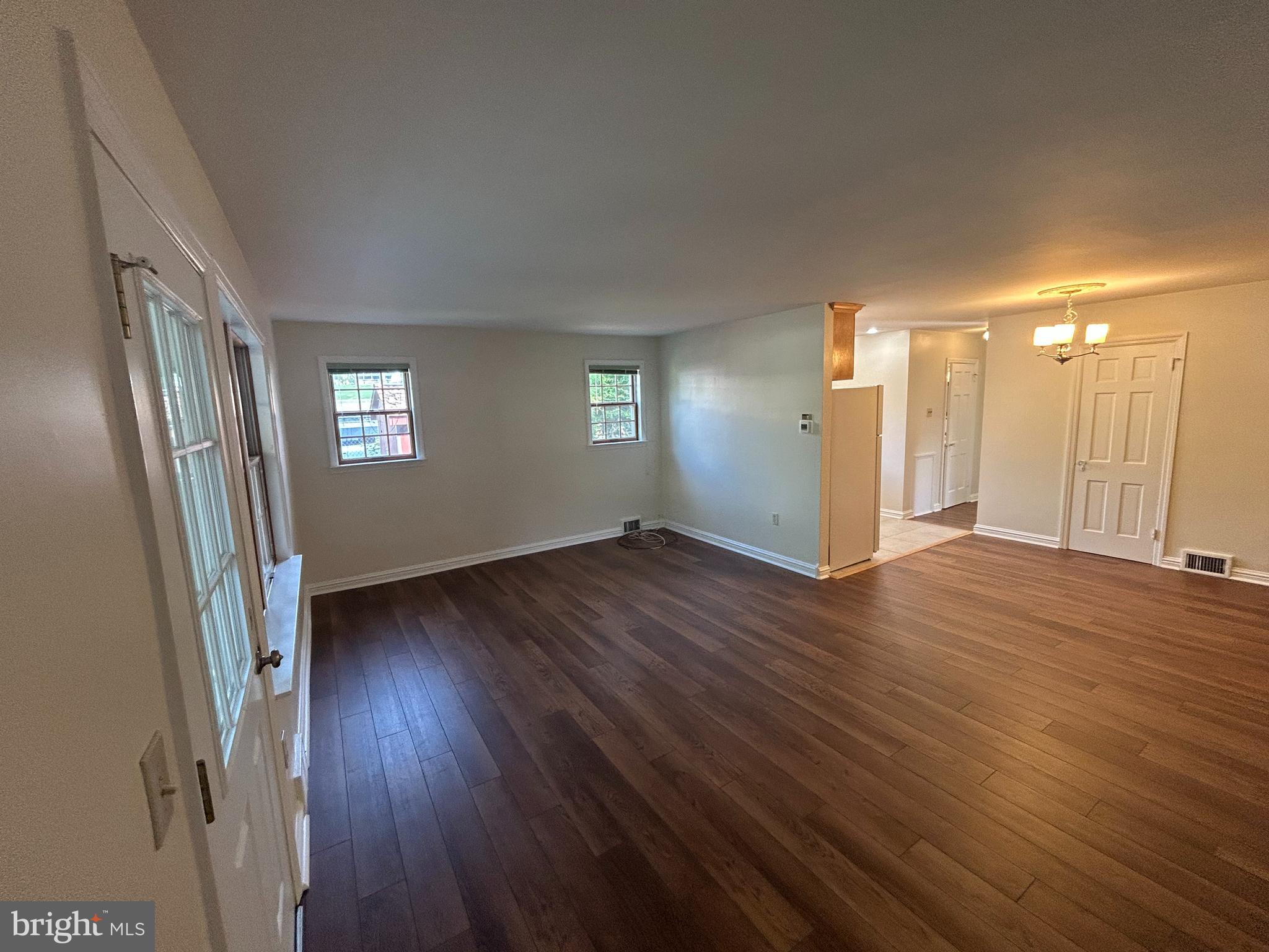 214 Grayling Avenue, Unit ONE Narberth, PA 19072 - Photo 5 of 22 an empty room with wooden floor and windows