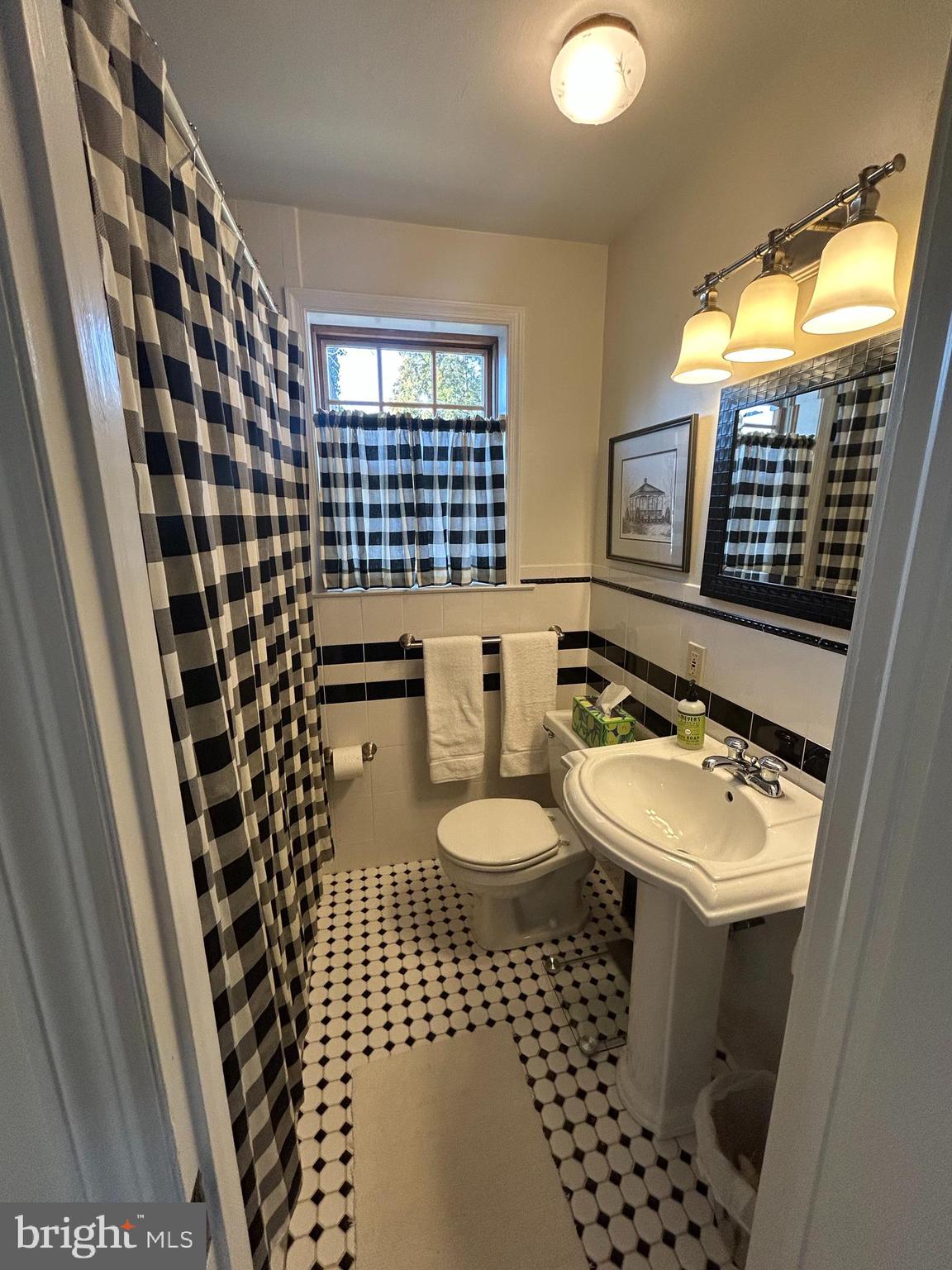 214 Grayling Avenue, Unit ONE Narberth, PA 19072 - Photo 9 of 22 a bathroom with a sink toilet and shower
