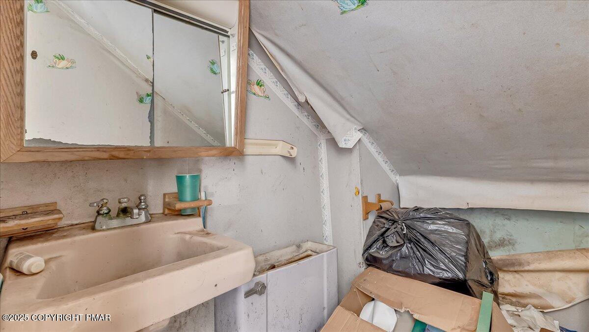 202 Price Road Stroudsburg, PA 18360 - Photo 19 of 45 a kitchen with stainless steel appliances granite countertop a sink and a white cabinets with wooden floor