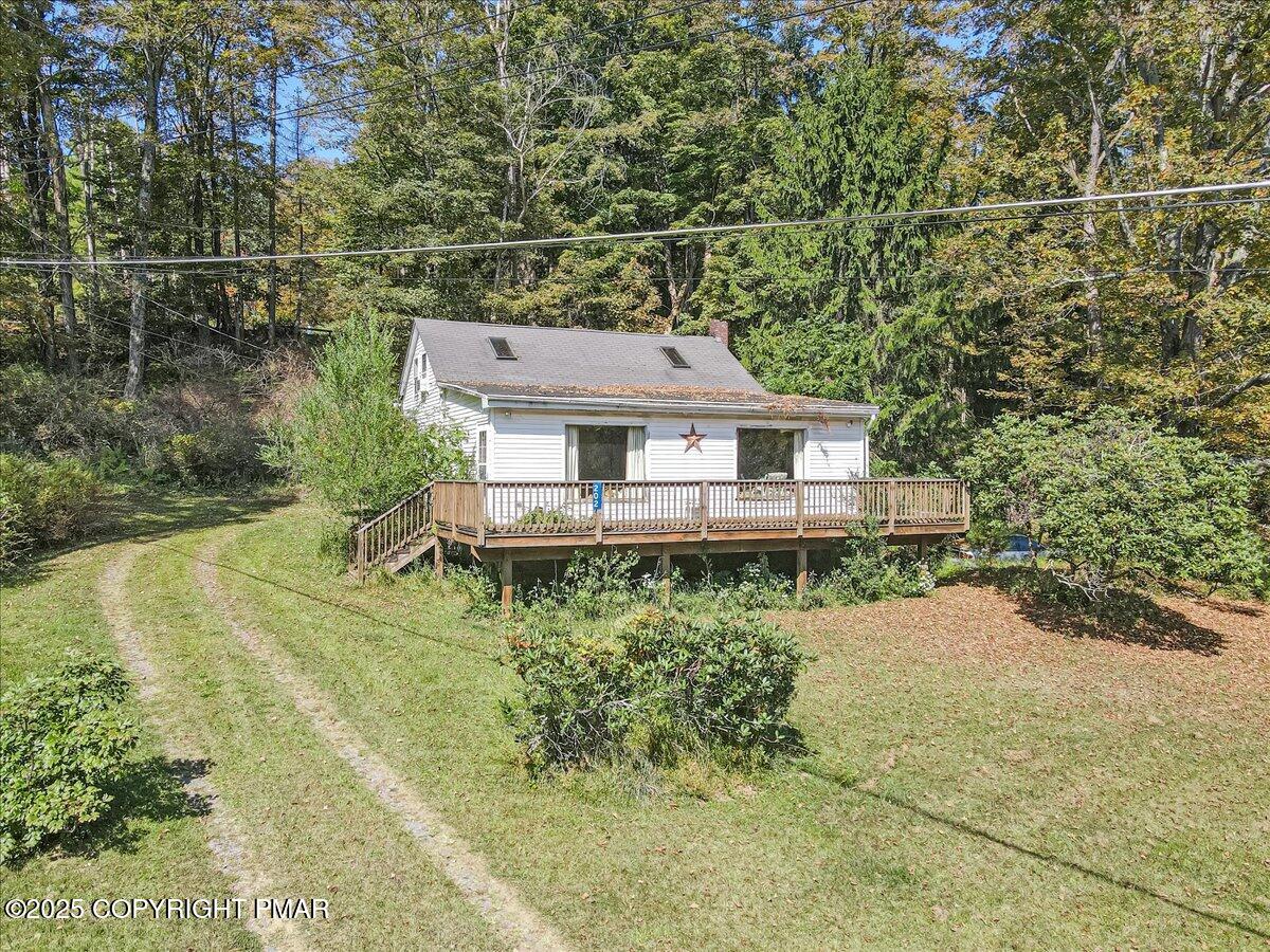 202 Price Road Stroudsburg, PA 18360 - Photo 27 of 45 a aerial view of a house with a yard table and chairs