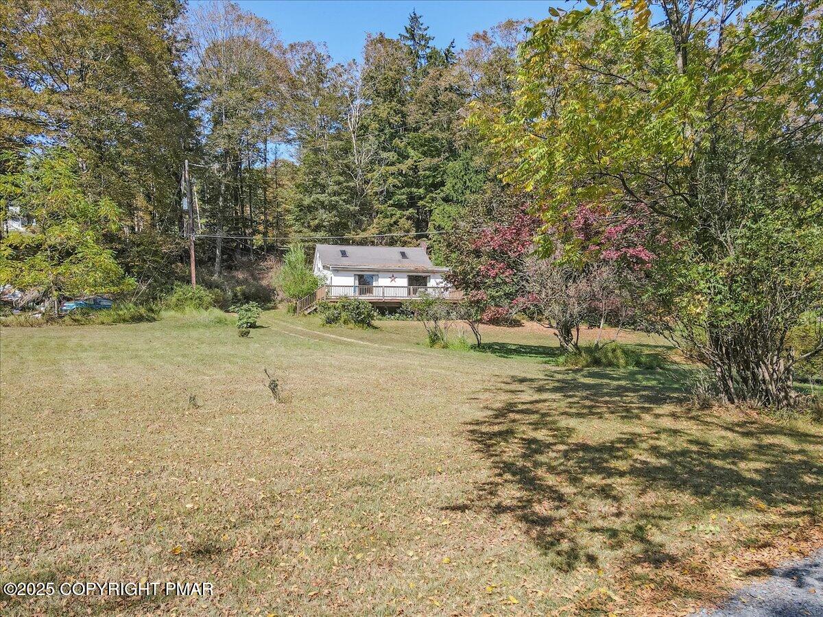 202 Price Road Stroudsburg, PA 18360 - Photo 30 of 45 a backyard of a house with lots of green space
