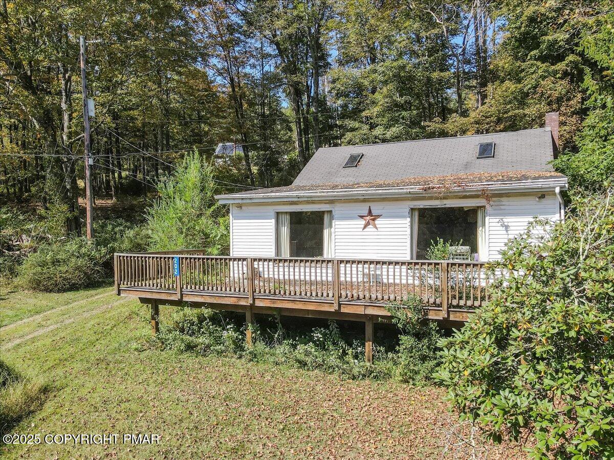 202 Price Road Stroudsburg, PA 18360 - Photo 5 of 45 a view of a house with a yard and sitting area