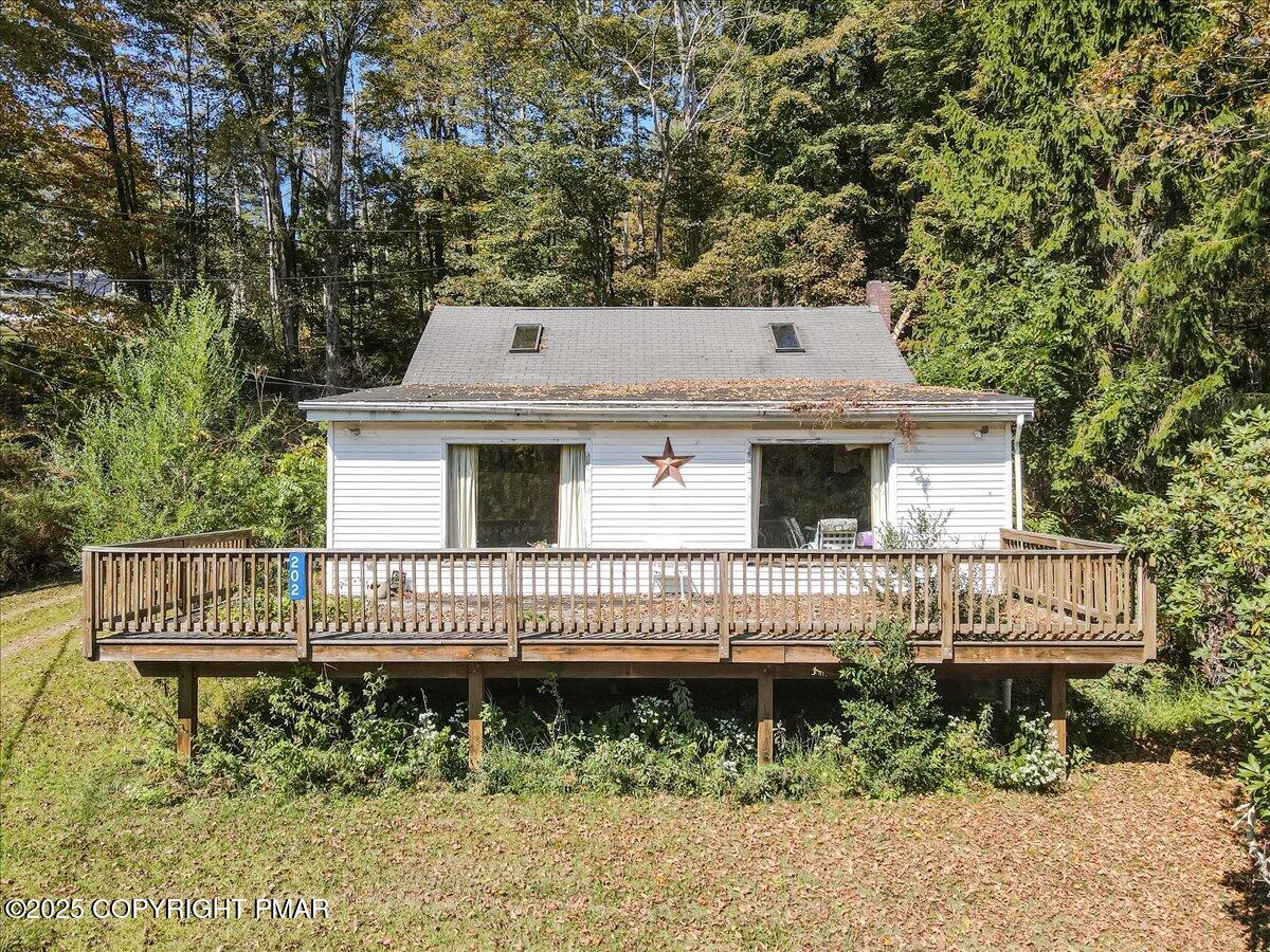 202 Price Road Stroudsburg, PA 18360 - Photo 6 of 45 a view of a house with a deck and a yard