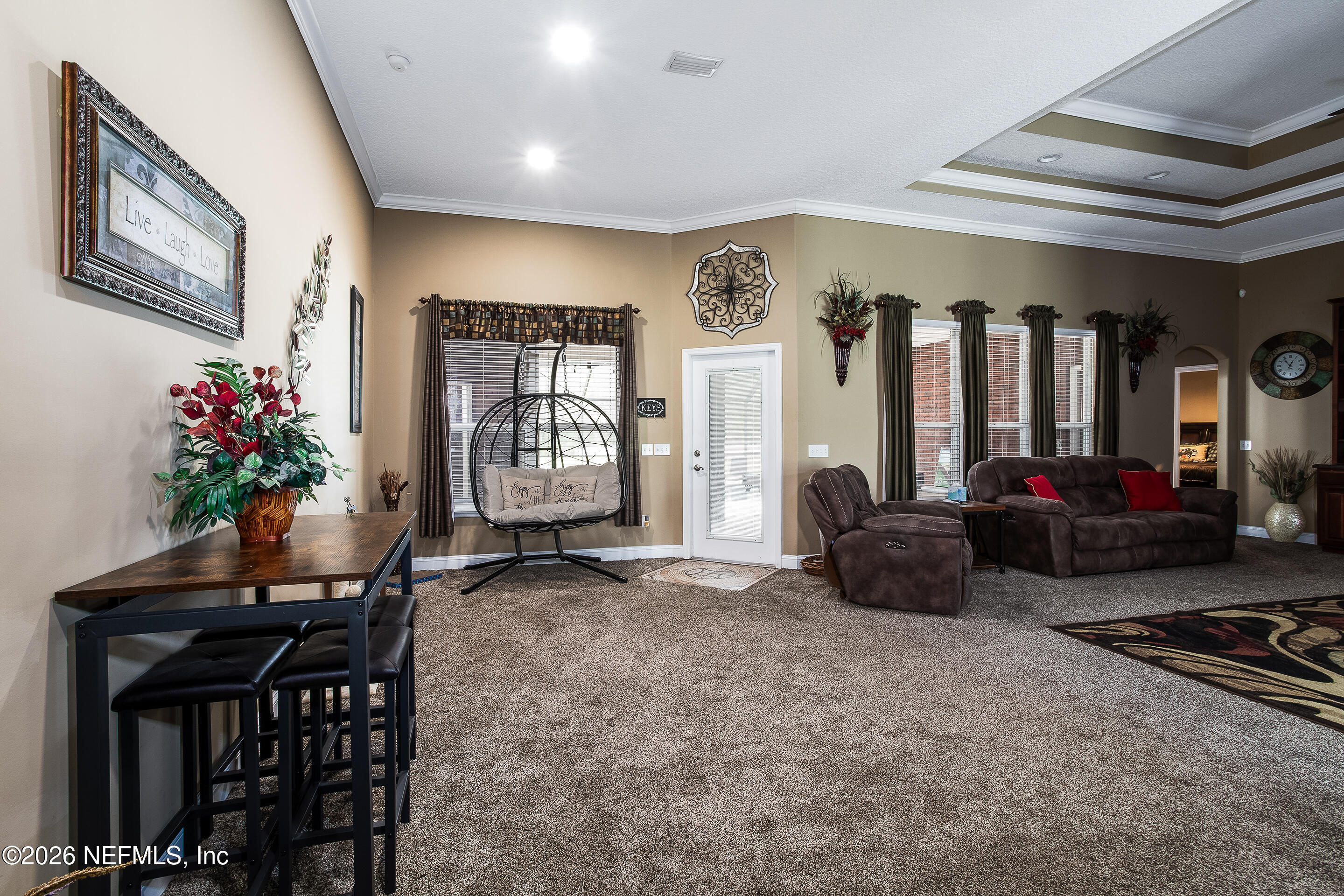 3795 Raintree Drive Macclenny, FL 32063 - Photo 11 of 40 a living room with furniture a piano and a flat screen tv