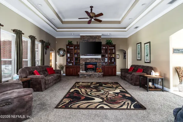a living room with furniture and a flat screen tv