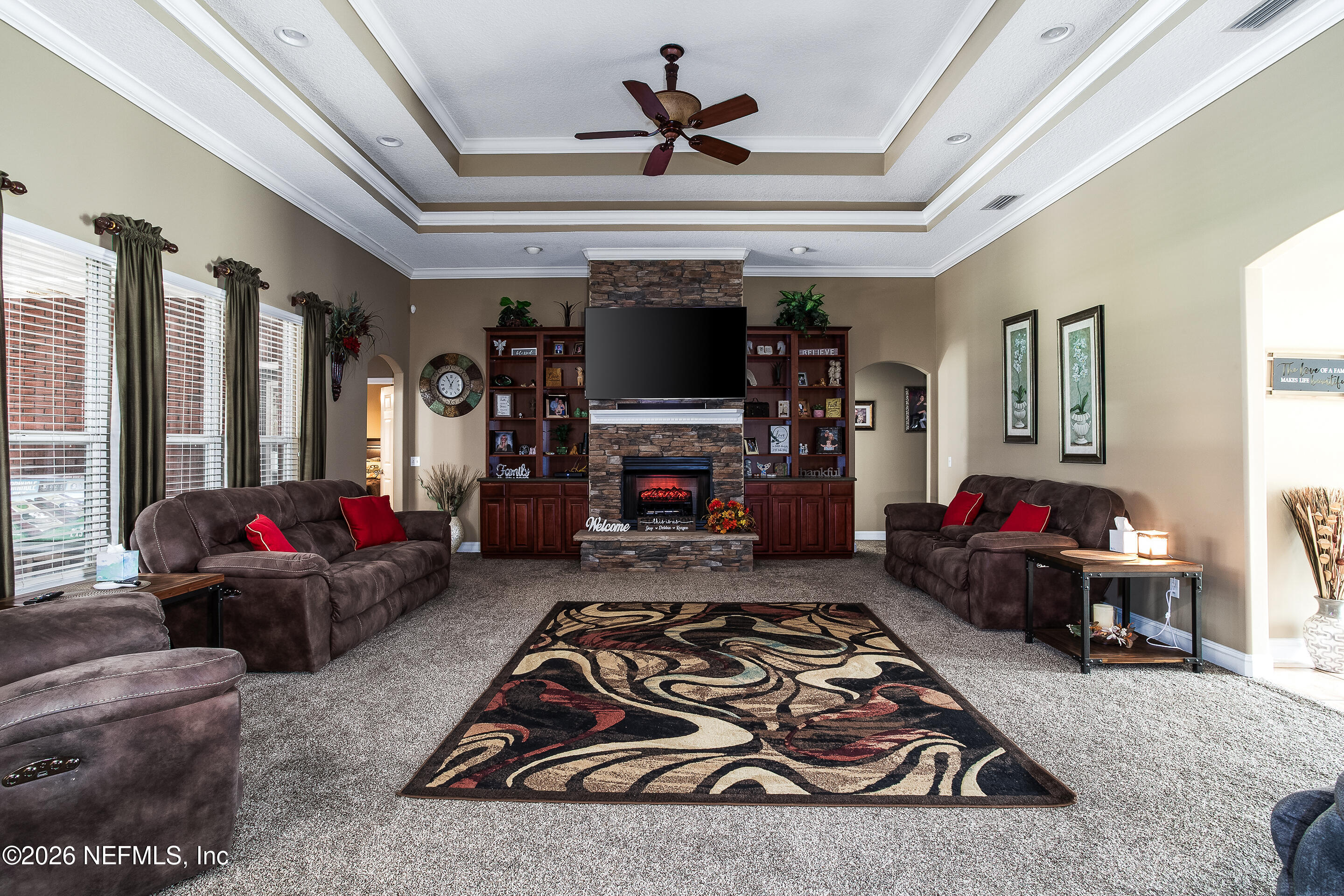 3795 Raintree Drive Macclenny, FL 32063 - Photo 12 of 40 a living room with furniture and a flat screen tv