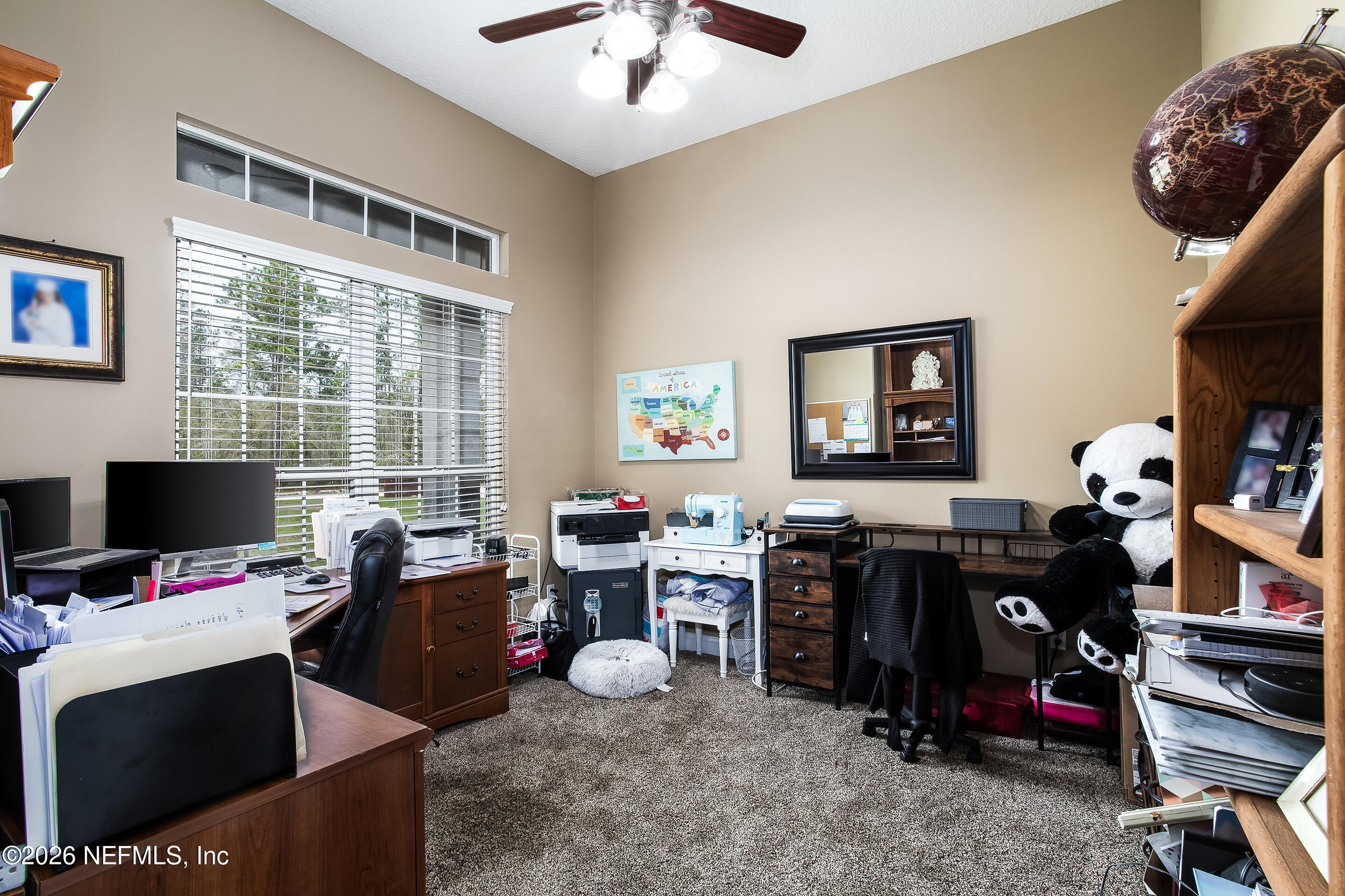 3795 Raintree Drive Macclenny, FL 32063 - Photo 13 of 40 a view of a workspace with furniture and a window