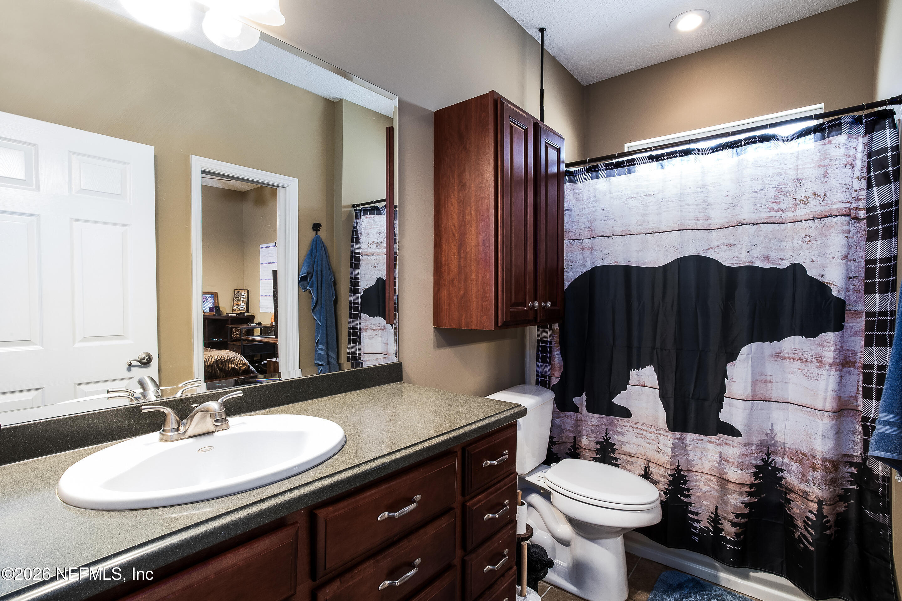 3795 Raintree Drive Macclenny, FL 32063 - Photo 17 of 40 a bathroom with a sink vanity granite and toilet