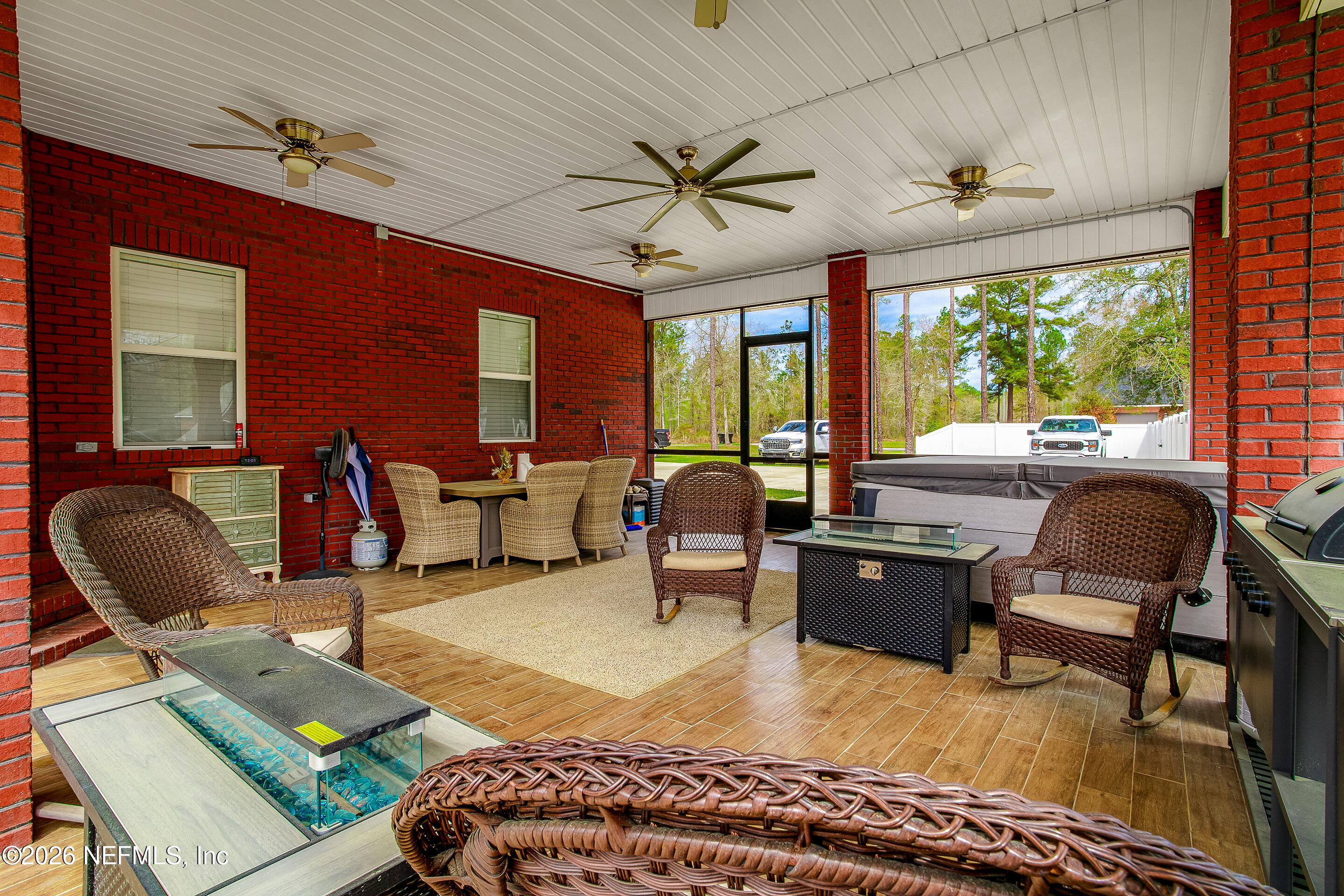 3795 Raintree Drive Macclenny, FL 32063 - Photo 19 of 40 a living room with furniture ceiling fan and a large window