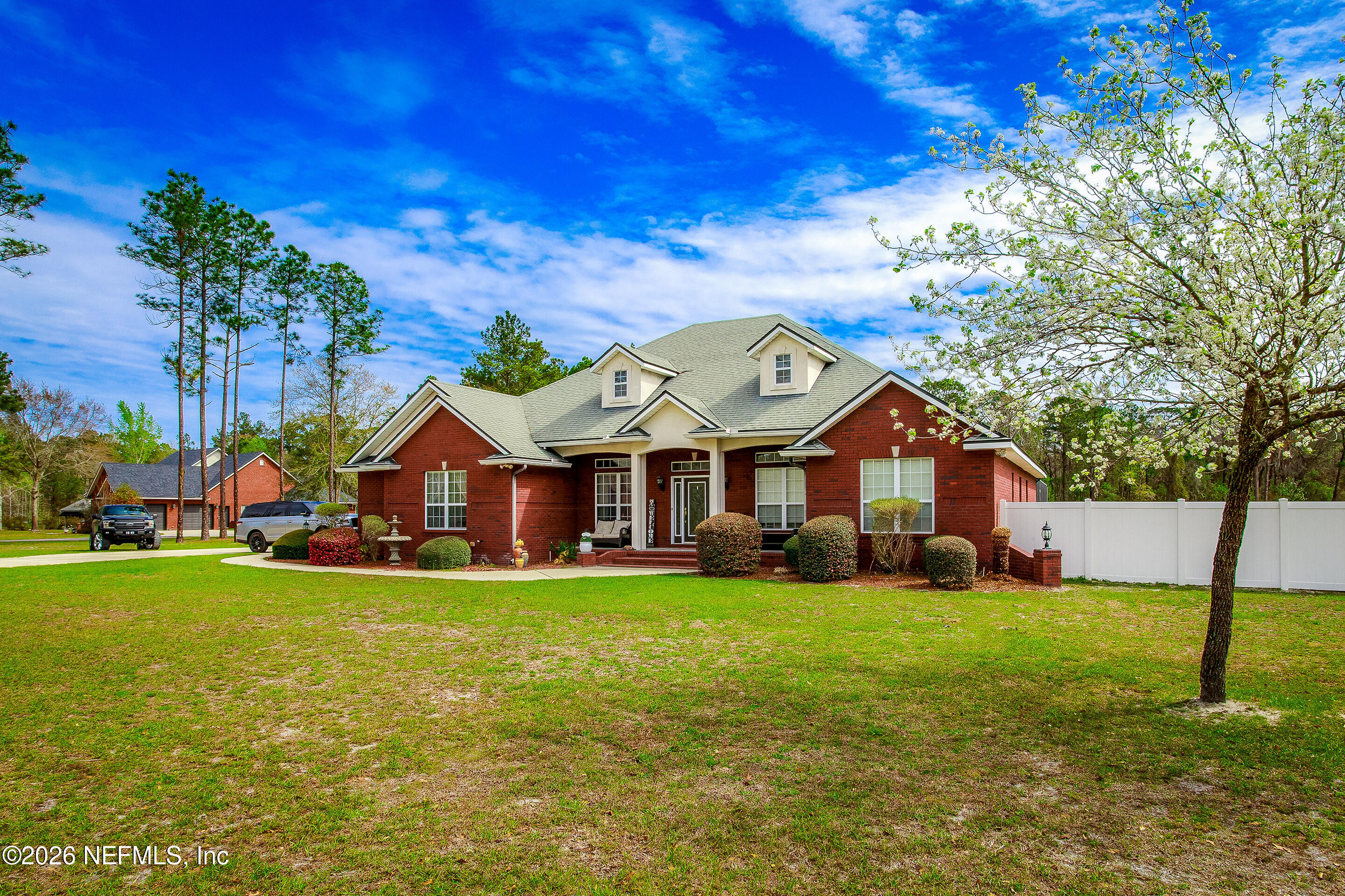 3795 Raintree Drive Macclenny, FL 32063 - Photo 2 of 40 a view of a house with a big yard