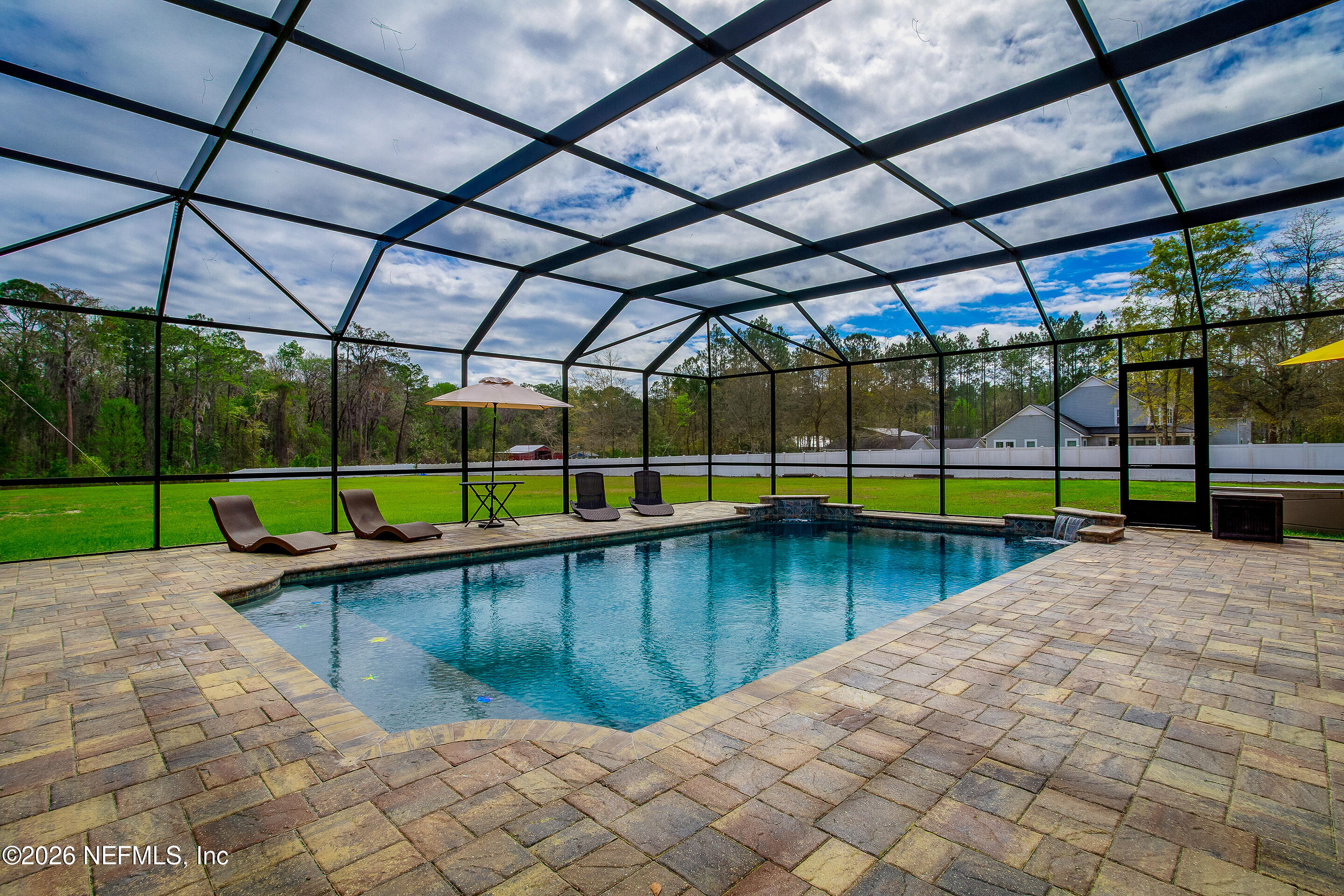 3795 Raintree Drive Macclenny, FL 32063 - Photo 21 of 40 a view of a backyard with a swimming pool