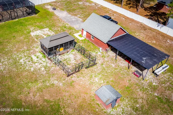 a aerial view of a house with a yard
