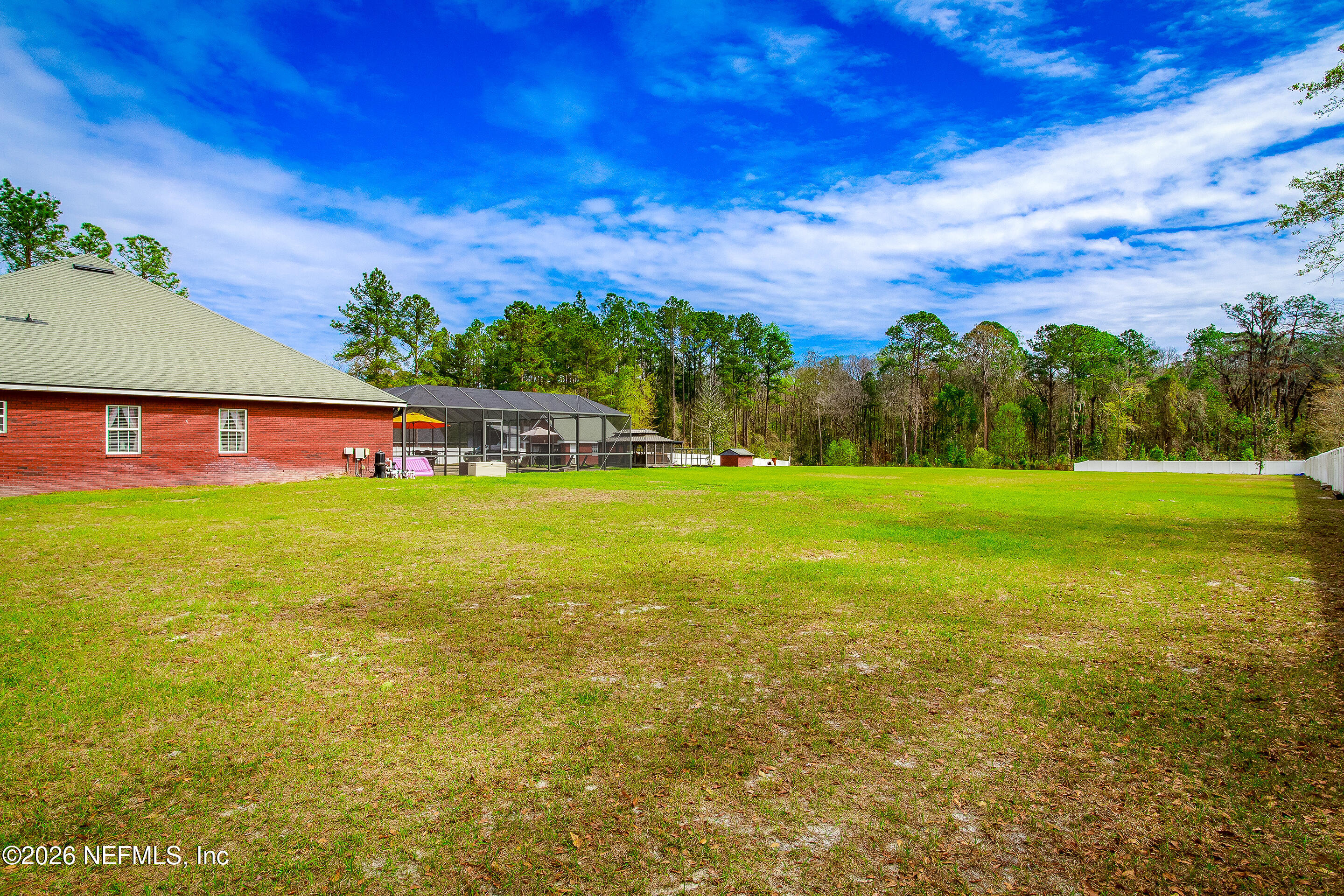 3795 Raintree Drive Macclenny, FL 32063 - Photo 28 of 40 a view of yard with swimming pool and green space