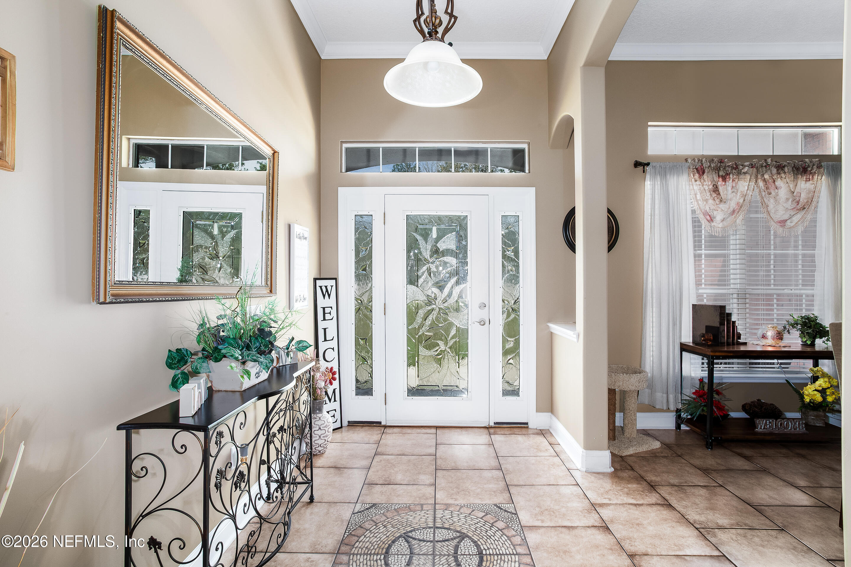 3795 Raintree Drive Macclenny, FL 32063 - Photo 3 of 40 a living room with furniture and a potted plant