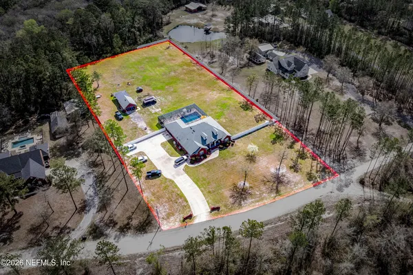 an aerial view of a house with outdoor space