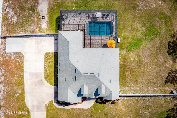 an aerial view of residential house with outdoor space