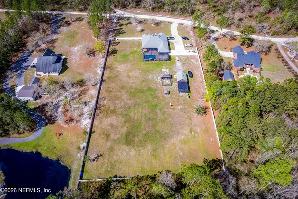 an aerial view of residential houses with outdoor space