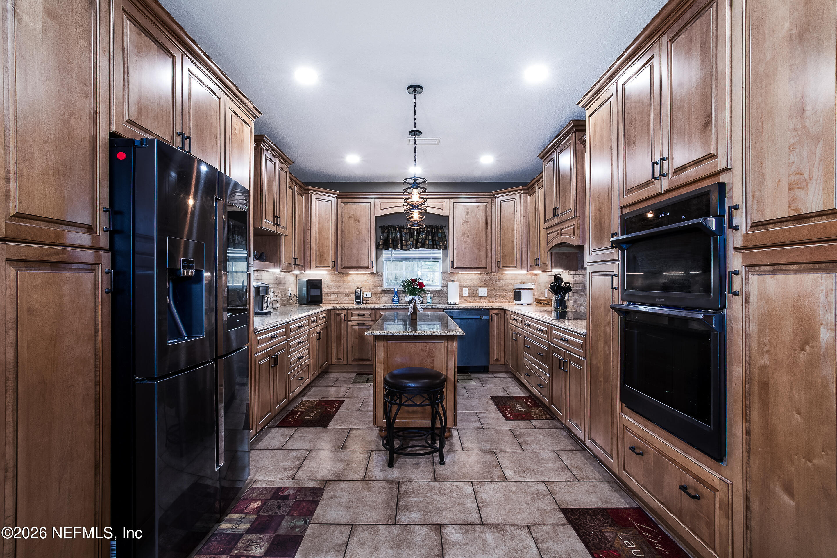 3795 Raintree Drive Macclenny, FL 32063 - Photo 5 of 40 a kitchen with stainless steel appliances granite countertop a refrigerator a stove a sink dishwasher and a refrigerator