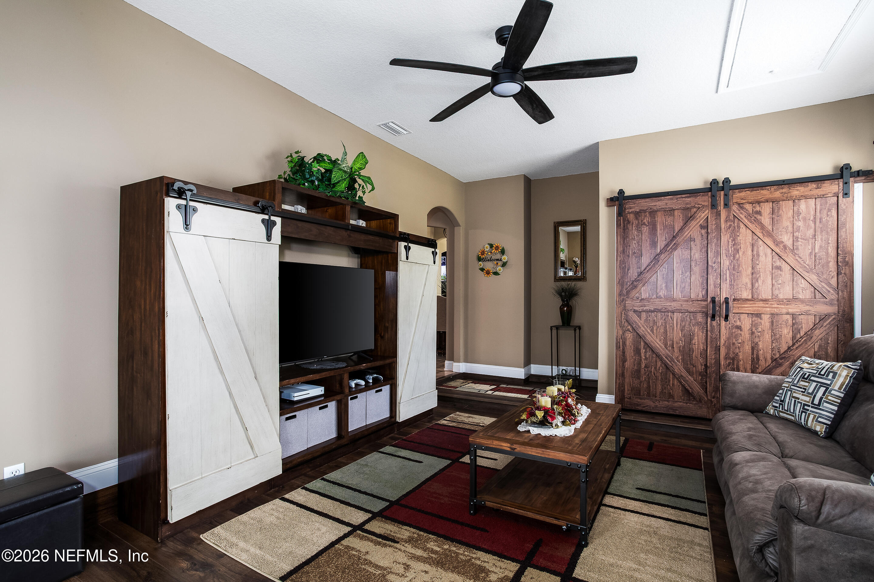 3795 Raintree Drive Macclenny, FL 32063 - Photo 7 of 40 a living room with furniture and a flat screen tv
