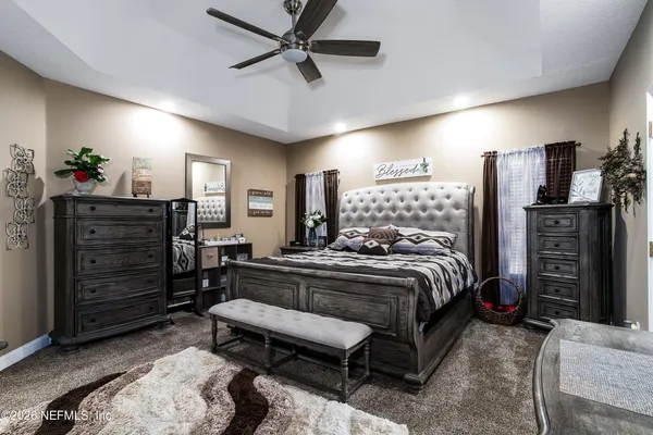 a bed room with a bed window and a television