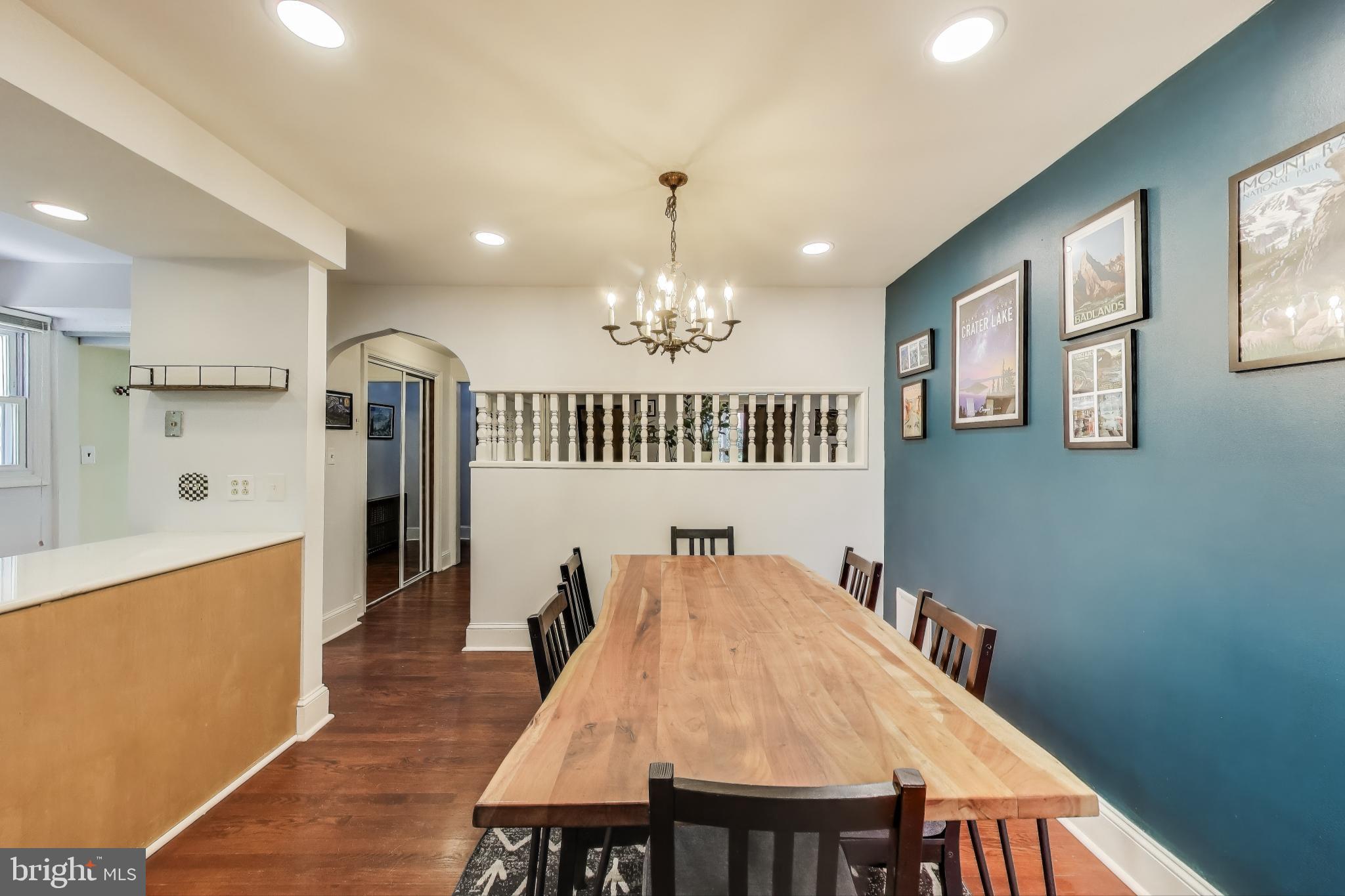 805 Islington Street Silver Spring, MD 20910 - Photo 11 of 50 a dining room with furniture a chandelier and wooden floor