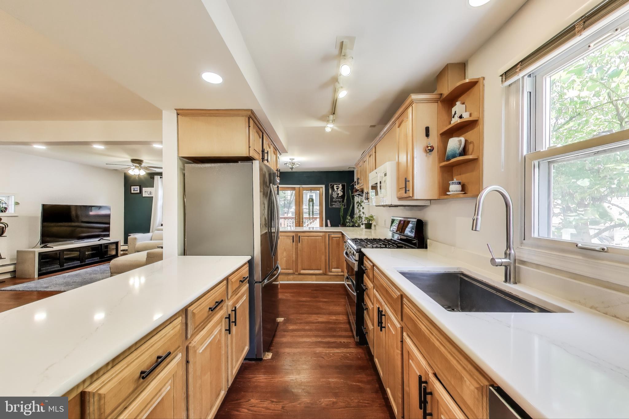 805 Islington Street Silver Spring, MD 20910 - Photo 13 of 50 a large kitchen with stainless steel appliances lots of counter space and a sink