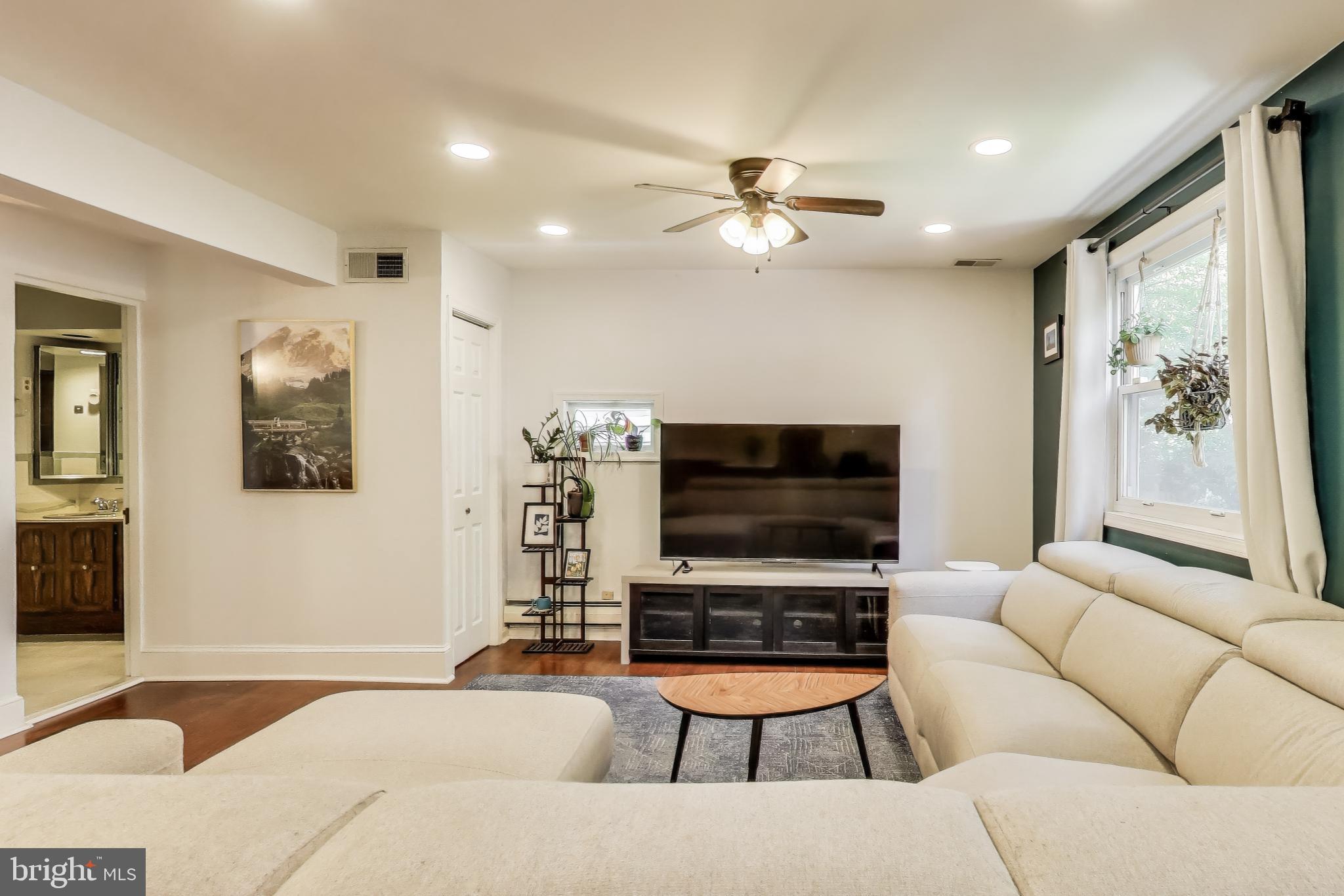 805 Islington Street Silver Spring, MD 20910 - Photo 18 of 50 a living room with furniture and a flat screen tv